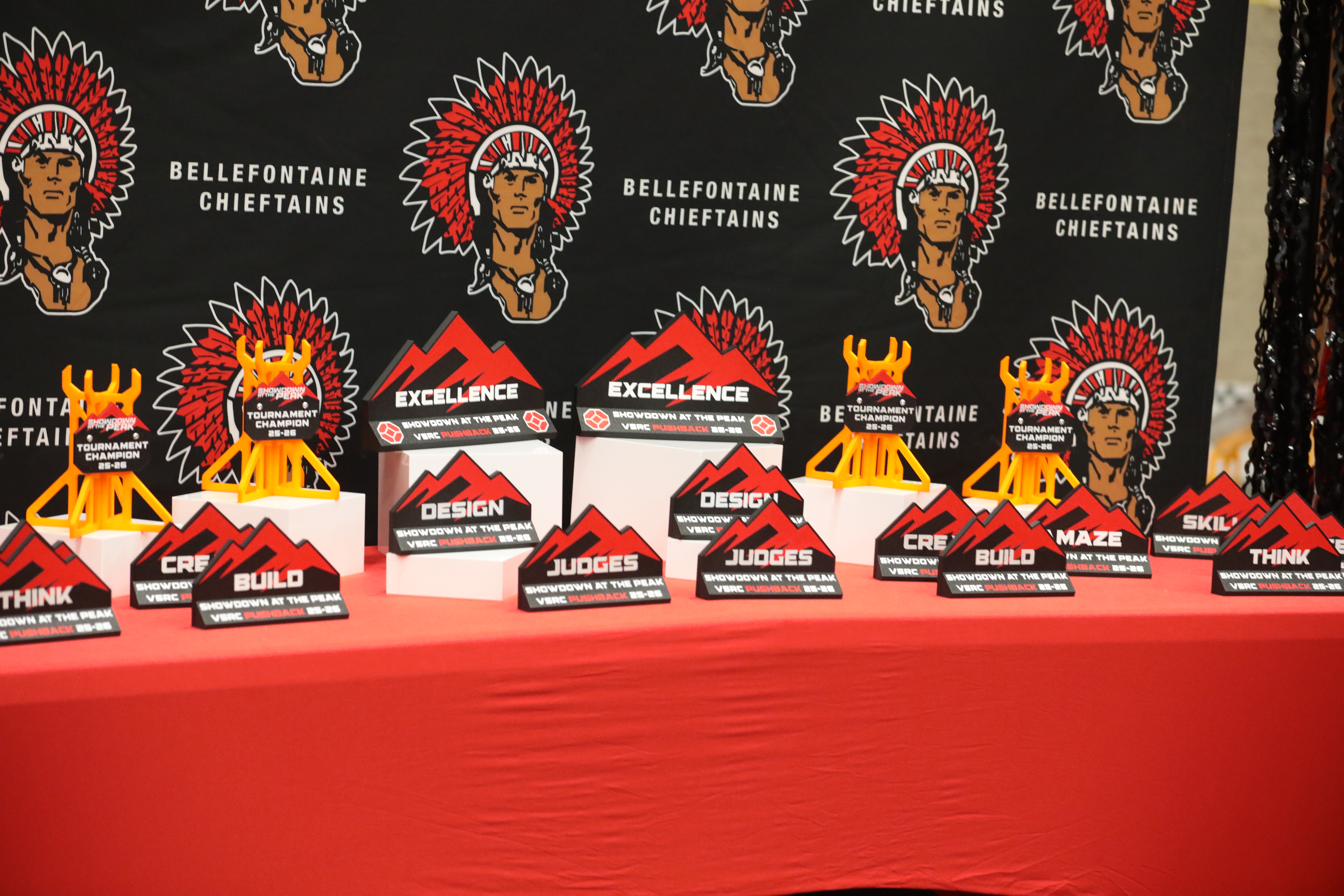 An awards table showing all the awards trophies available at this robotics event.