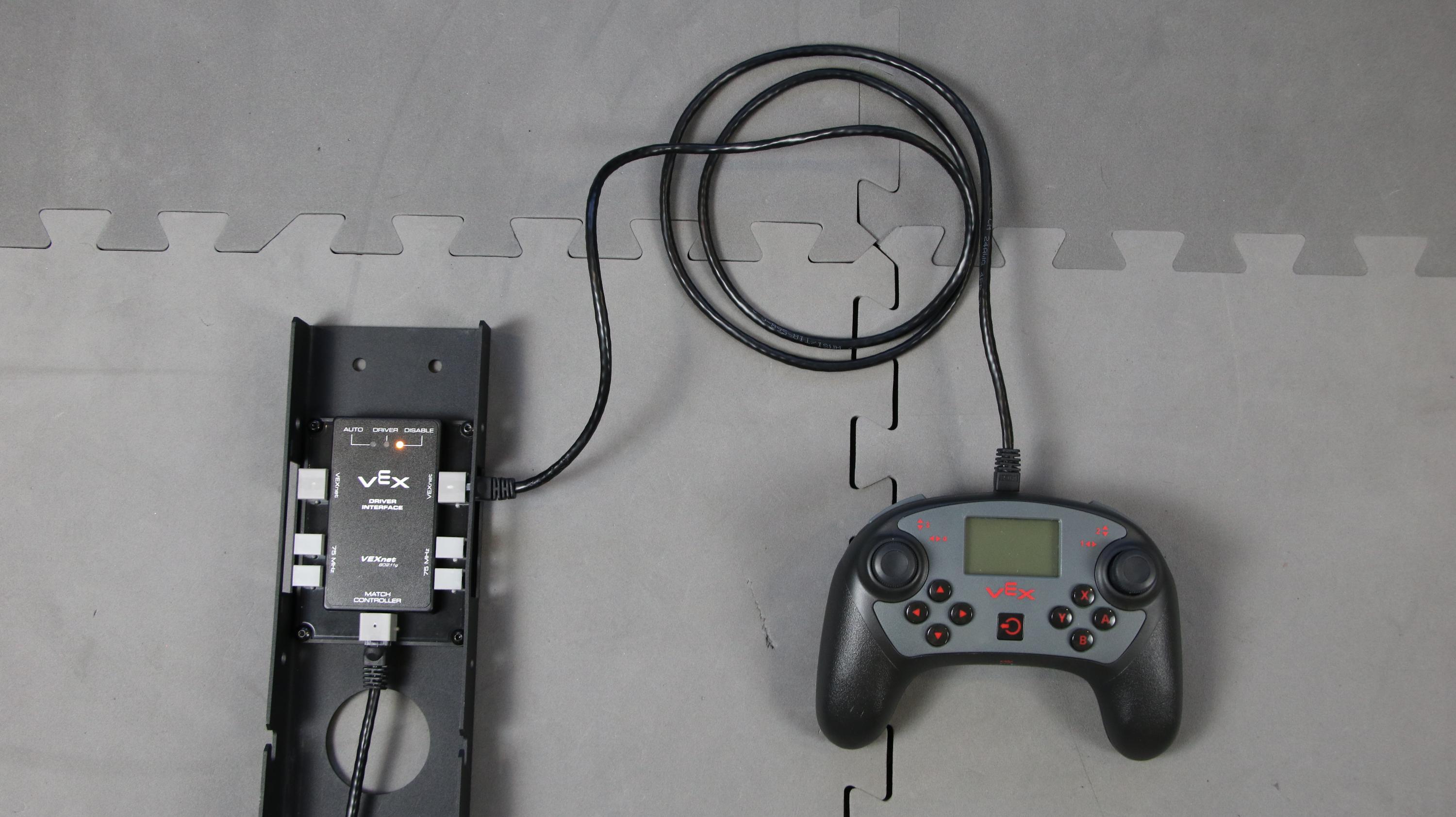 Field Control System is shown powered on and connected to a V5 Controller using an Ethernet cable.