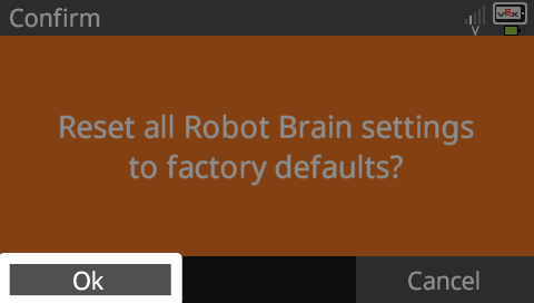 Brain screen is shown after the Reset settings option has been selected. The screen has an orange background and reads Confirm, Reset all Robot Brain settings to factory defaults? There are two buttons below reading OK and Cancel, and the OK button is highlighted.
