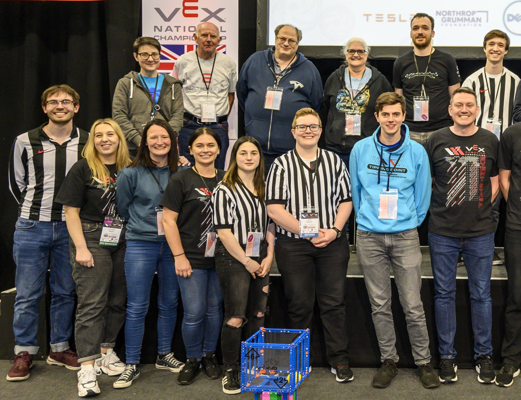 A group of Scorekeepers and Referees and other volunteers at a VEX Robotics competition.